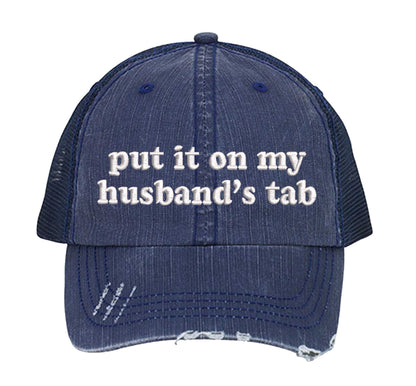 Navy Blue front profile view of a DSY Lifestyle distressed trucker hat featuring the words Put It On My Husband&