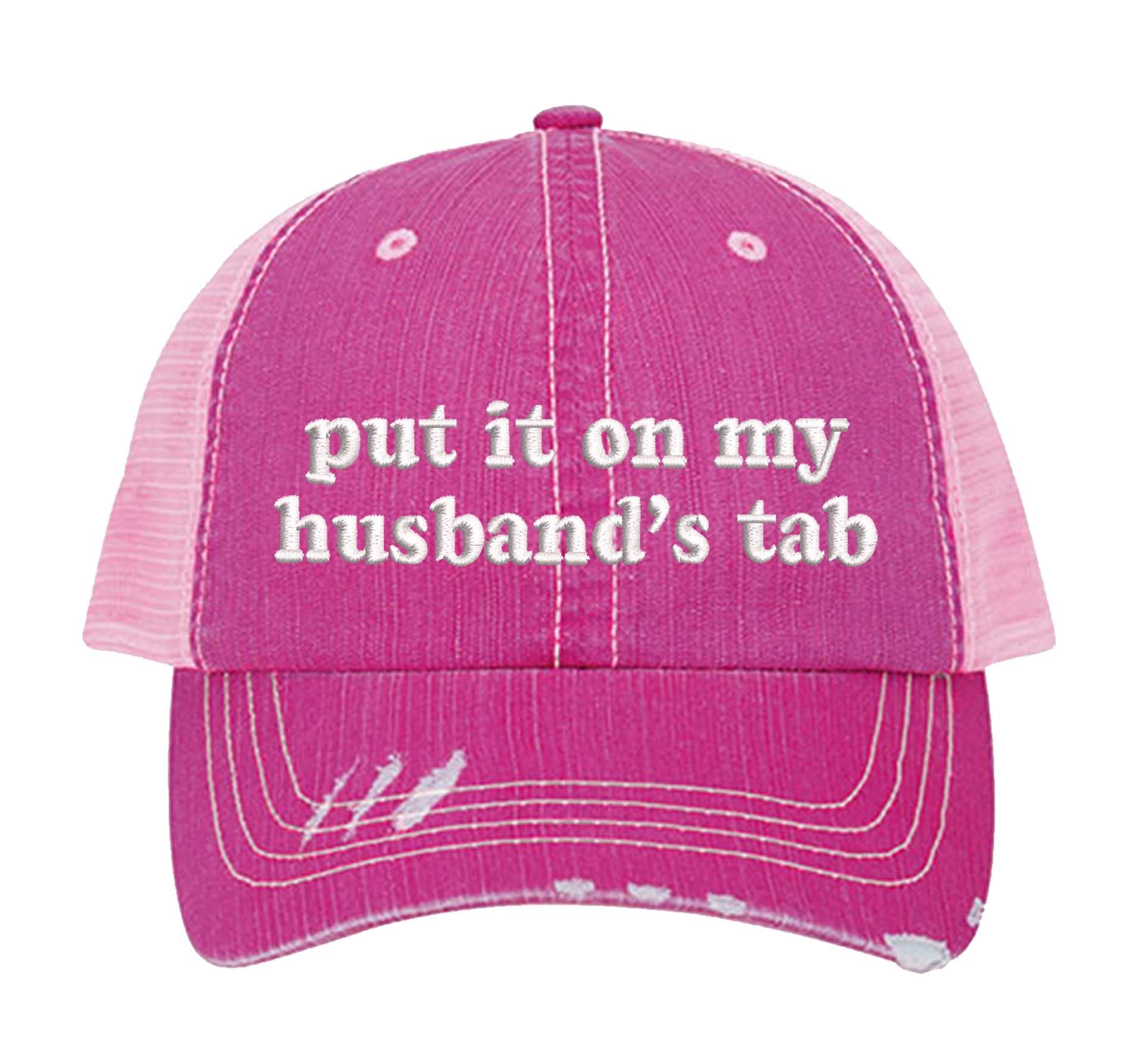 Pink front view of a DSY Lifestyle distressed trucker hat featuring the words Put It On My Husband&