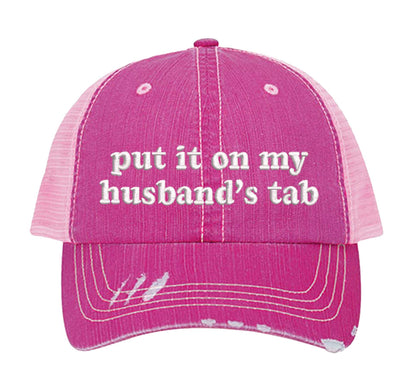 Pink front view of a DSY Lifestyle distressed trucker hat featuring the words Put It On My Husband&