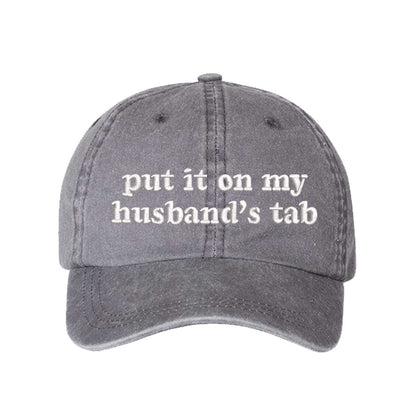 Gray Put It On My Husband’s Tab washed cotton baseball hat with a soft finish and high-density white embroidery by DSY Lifestyle. - DSY Lifestyle