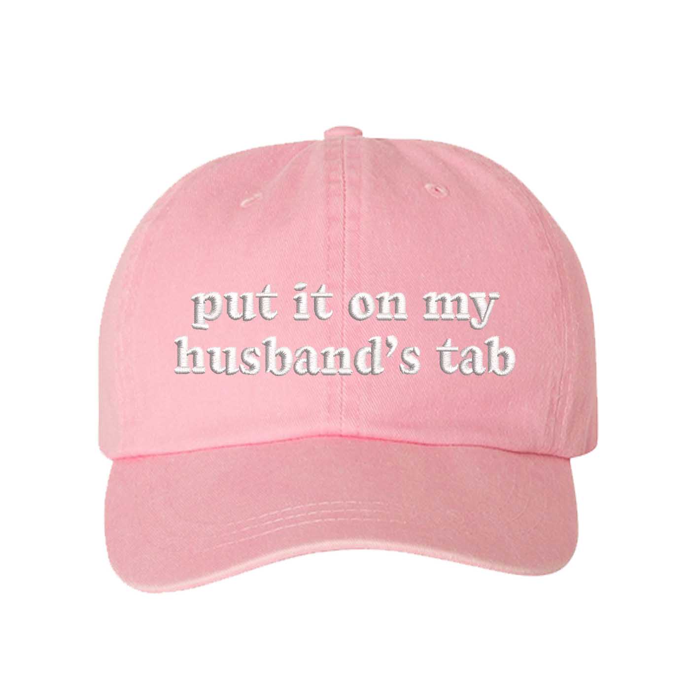 Light Pink Put It On My Husband’s Tab washed cotton baseball hat with a soft finish and high-density white embroidery by DSY Lifestyle. - DSY Lifestyle