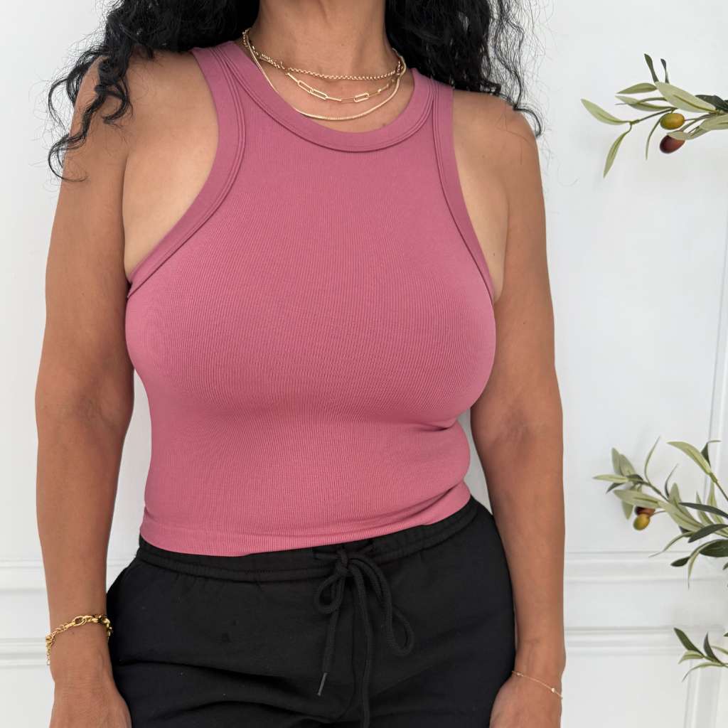 Close up of women wearing a seamless thick fabric ribbed tank top in mauve color