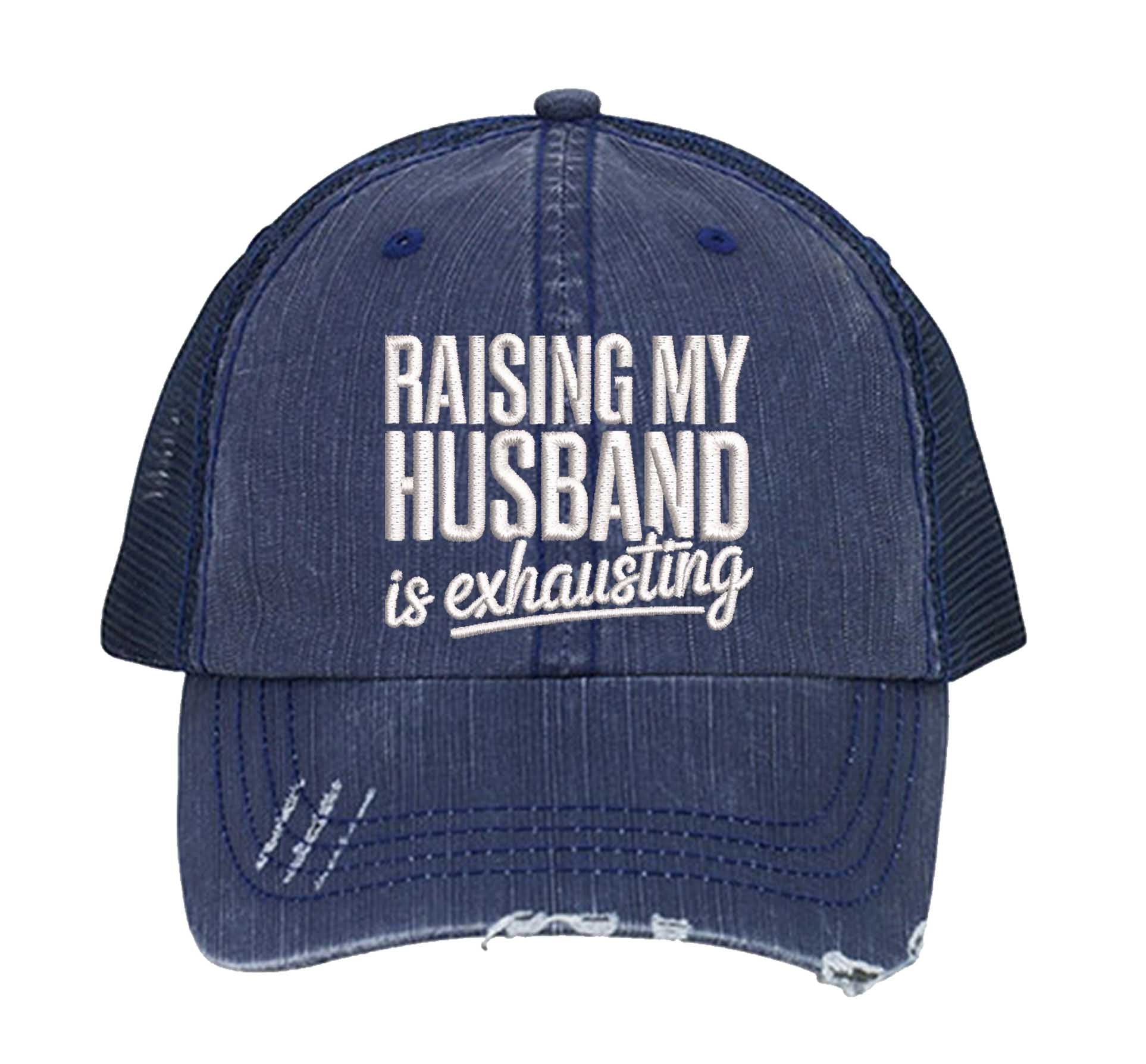 Navy Blue DSY Lifestyle distressed trucker hat featuring the phrase Raising My Husband Is Exhausting in bold, professional embroidery. - DSY Lifestyle