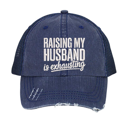Navy Blue DSY Lifestyle distressed trucker hat featuring the phrase Raising My Husband Is Exhausting in bold, professional embroidery. - DSY Lifestyle