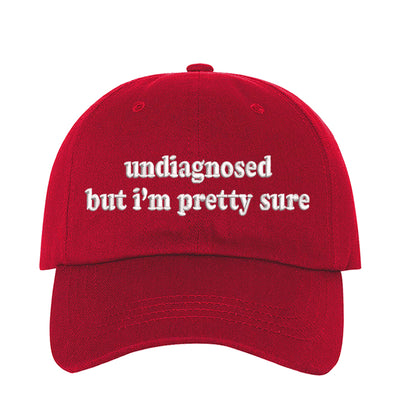 Red baseball hat embroidered with the phrase undiagnosed but im pretty sure-DSY Lifestyle