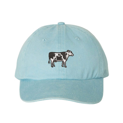 Sky Blue Holstein Cow Washed Baseball Hat featuring a detailed black and white Holstein cow embroidered on a premium washed cotton crown; a heritage-inspired farm life piece by DSY Lifestyle.