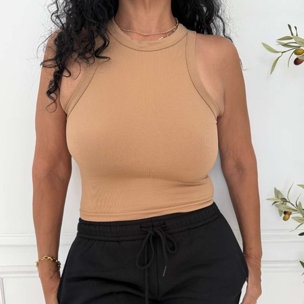 Close up of women wearing a seamless thick fabric ribbed tank top in tan color