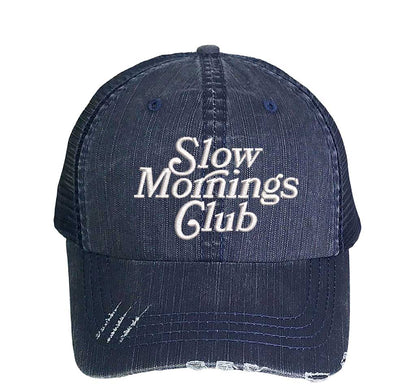 Navy blue distressed trucker cap embroidered with Slow Mornings Club DSY Lifestyle