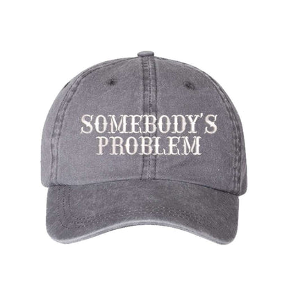 Washed Grey baseball hat embroidered with the phrase somebody&