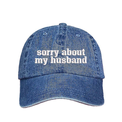 Light Denim Sorry About My Husband Embroidered Baseball Hat in classic cotton dad cap style with curved brim and hook and loop closure. DSY Lifestyle.