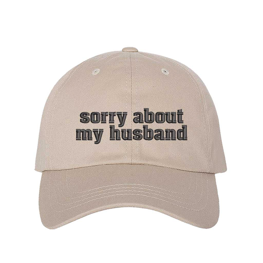 Stone Sorry About My Husband Embroidered Baseball Hat in classic cotton dad cap style with curved brim and hook and loop closure. DSY Lifestyle.
