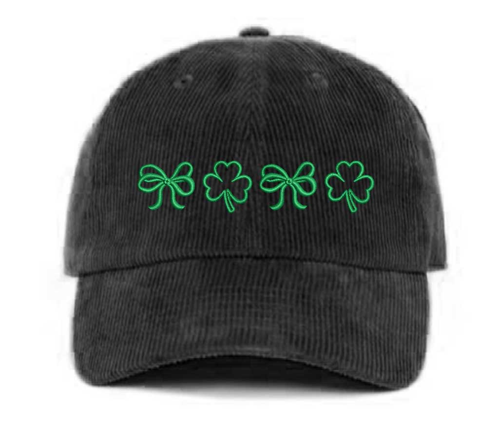Black soft corduroy baseball hat with embroidered bow and clover doodles, combining cozy texture with playful design for a stylish, everyday look - DSY Lifestyle