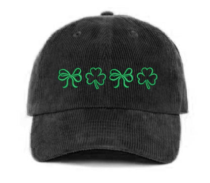 Black soft corduroy baseball hat with embroidered bow and clover doodles, combining cozy texture with playful design for a stylish, everyday look - DSY Lifestyle