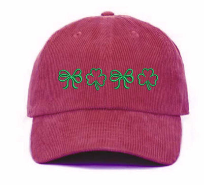 Burgundy soft corduroy baseball hat with embroidered bow and clover doodles, combining cozy texture with playful design for a stylish, everyday look - DSY Lifestyle