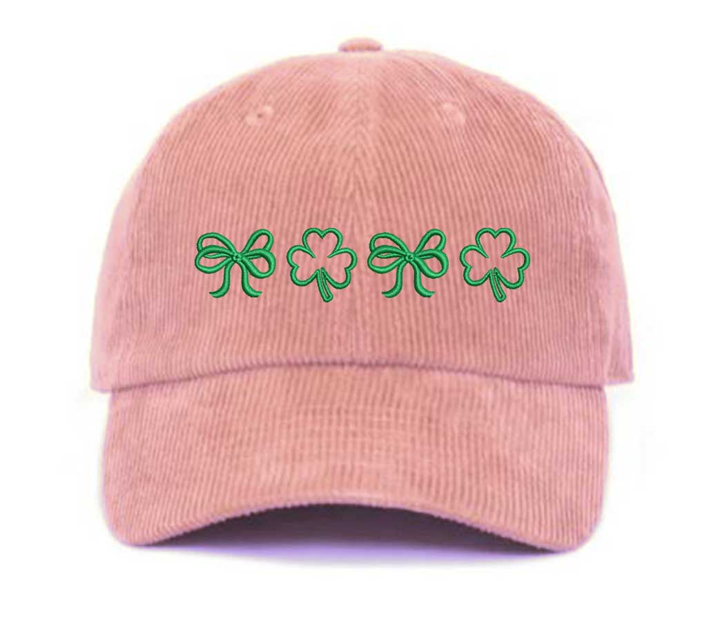 Pink soft corduroy baseball hat with embroidered bow and clover doodles, combining cozy texture with playful design for a stylish, everyday look - DSY Lifestyle