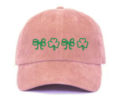 Pink soft corduroy baseball hat with embroidered bow and clover doodles, combining cozy texture with playful design for a stylish, everyday look - DSY Lifestyle