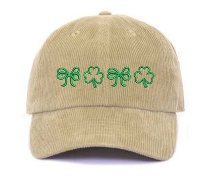 Stone soft corduroy baseball hat with embroidered bow and clover doodles, combining cozy texture with playful design for a stylish, everyday look - DSY Lifestyle