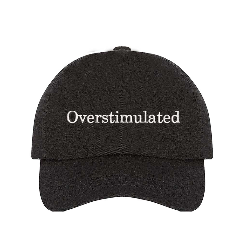 Black DSY Lifestyle soft cotton baseball hat with the word Overstimulated embroidered in clean, minimalist lowercase lettering across the front. - DSY Lifestyle