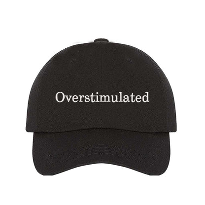 Black DSY Lifestyle soft cotton baseball hat with the word Overstimulated embroidered in clean, minimalist lowercase lettering across the front. - DSY Lifestyle