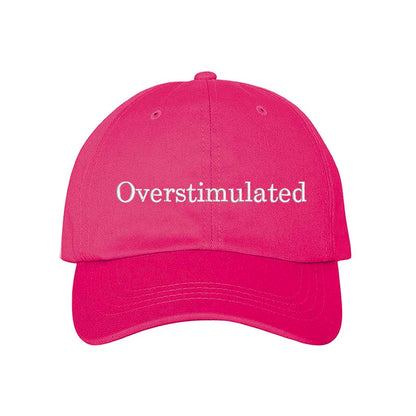 Hot Pink DSY Lifestyle soft cotton baseball hat with the word Overstimulated embroidered in clean, minimalist lowercase lettering across the front. - DSY Lifestyle