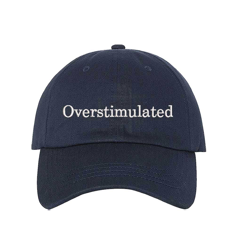 Navy Blue DSY Lifestyle soft cotton baseball hat with the word Overstimulated embroidered in clean, minimalist lowercase lettering across the front. - DSY Lifestyle