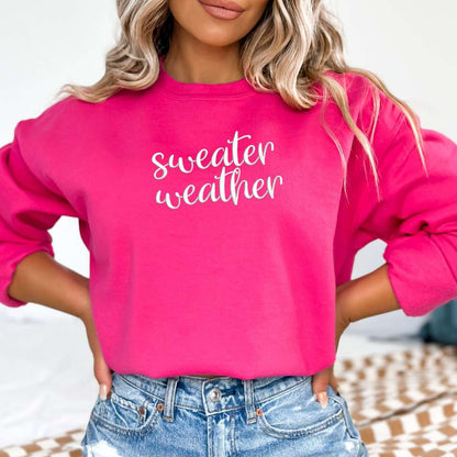 Female wearing a Hot Pink Sweatshirt with sweater weather embroidered in the front - DSY Lifestyle