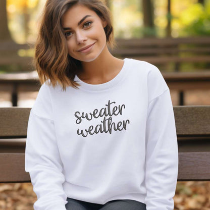 Female wearing a White Sweatshirt with sweater weather embroidered in the front - DSY Lifestyle