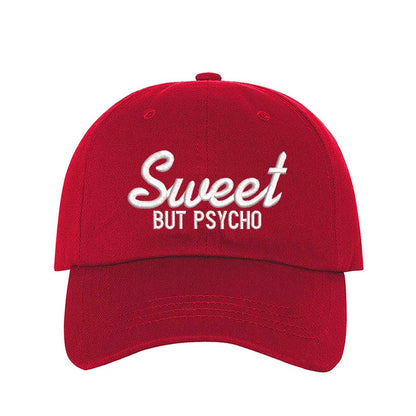 Red Close-up of a DSY Lifestyle baseball hat with "Sweet But Psycho" embroidered in a clean, modern font; a funny statement gift for her.