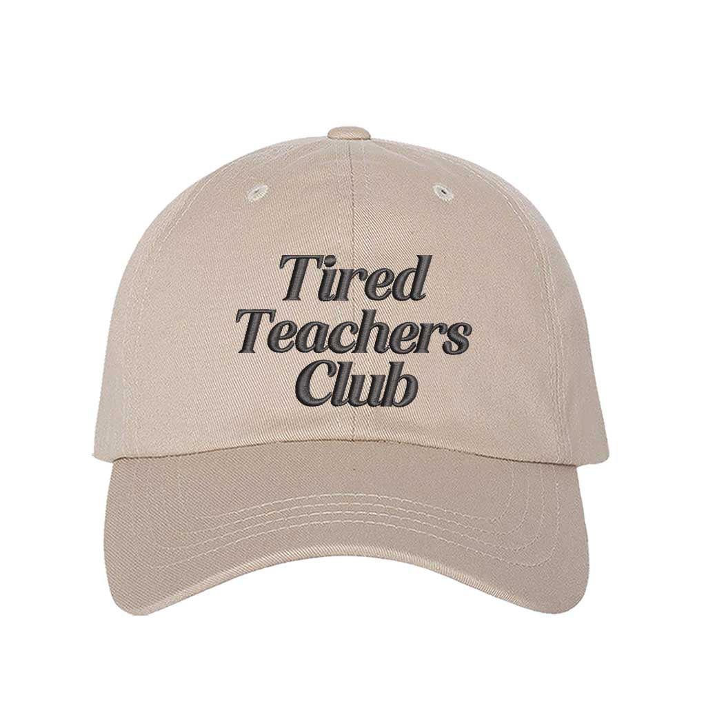 Stone DSY Lifestyle cotton baseball hat featuring the phrase Tired Teacher Club in bold, detailed professional embroidery. - DSY Lifestyle