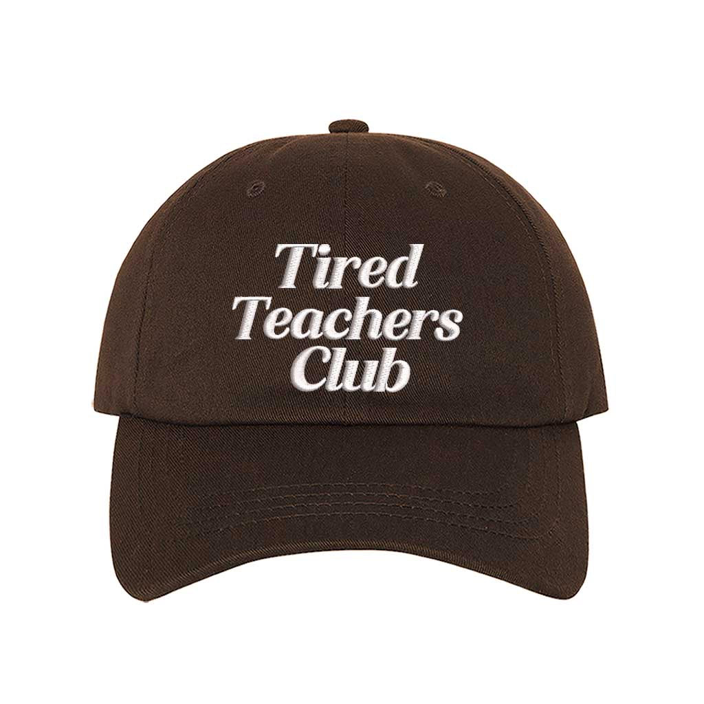 Brown DSY Lifestyle cotton baseball hat featuring the phrase Tired Teacher Club in bold, detailed professional embroidery. - DSY Lifestyle