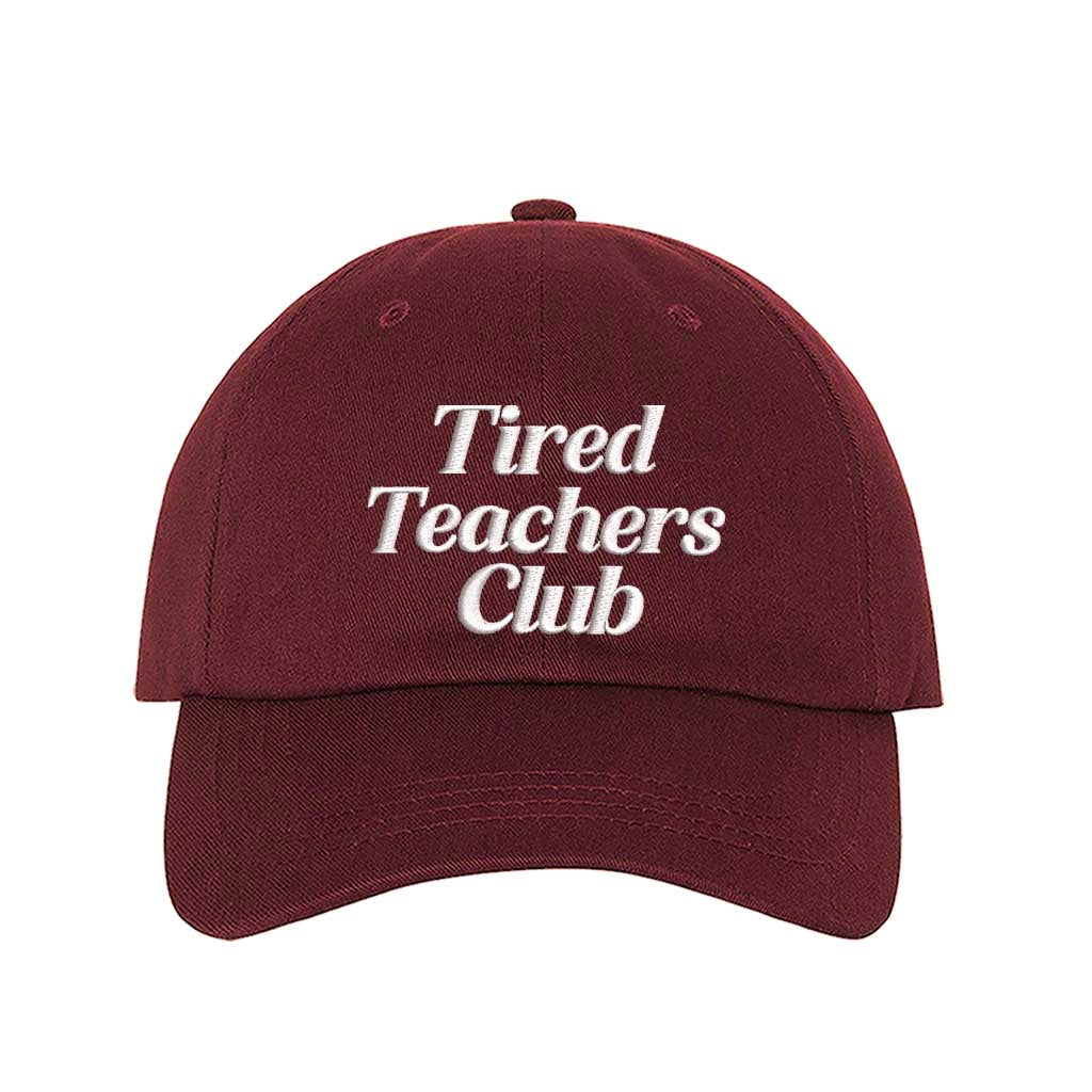 Burgundy DSY Lifestyle cotton baseball hat featuring the phrase Tired Teacher Club in bold, detailed professional embroidery. - DSY Lifestyle