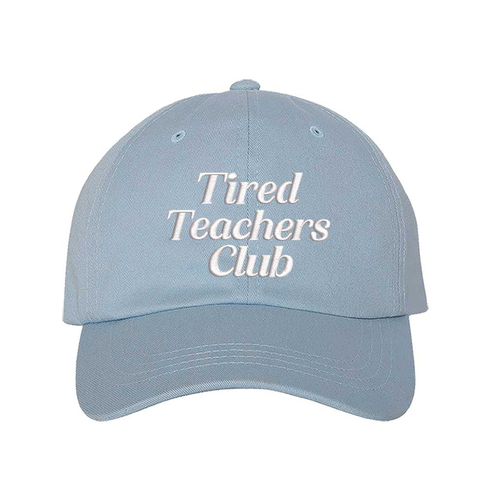 Sky Blue DSY Lifestyle cotton baseball hat featuring the phrase Tired Teacher Club in bold, detailed professional embroidery. - DSY Lifestyle