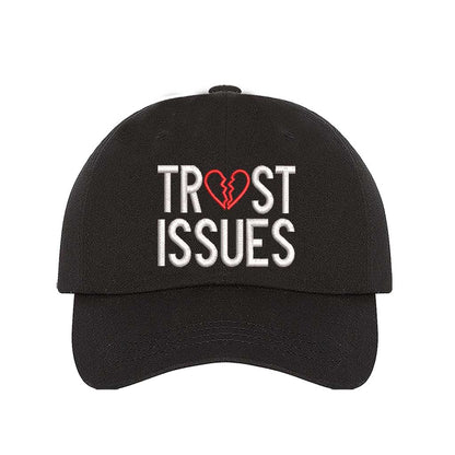 Black Trust Issues Baseball Hat featuring "Trust Issues" embroidered in a bold font on a classic dad cap; a funny and relatable statement accessory from DSY Lifestyle.