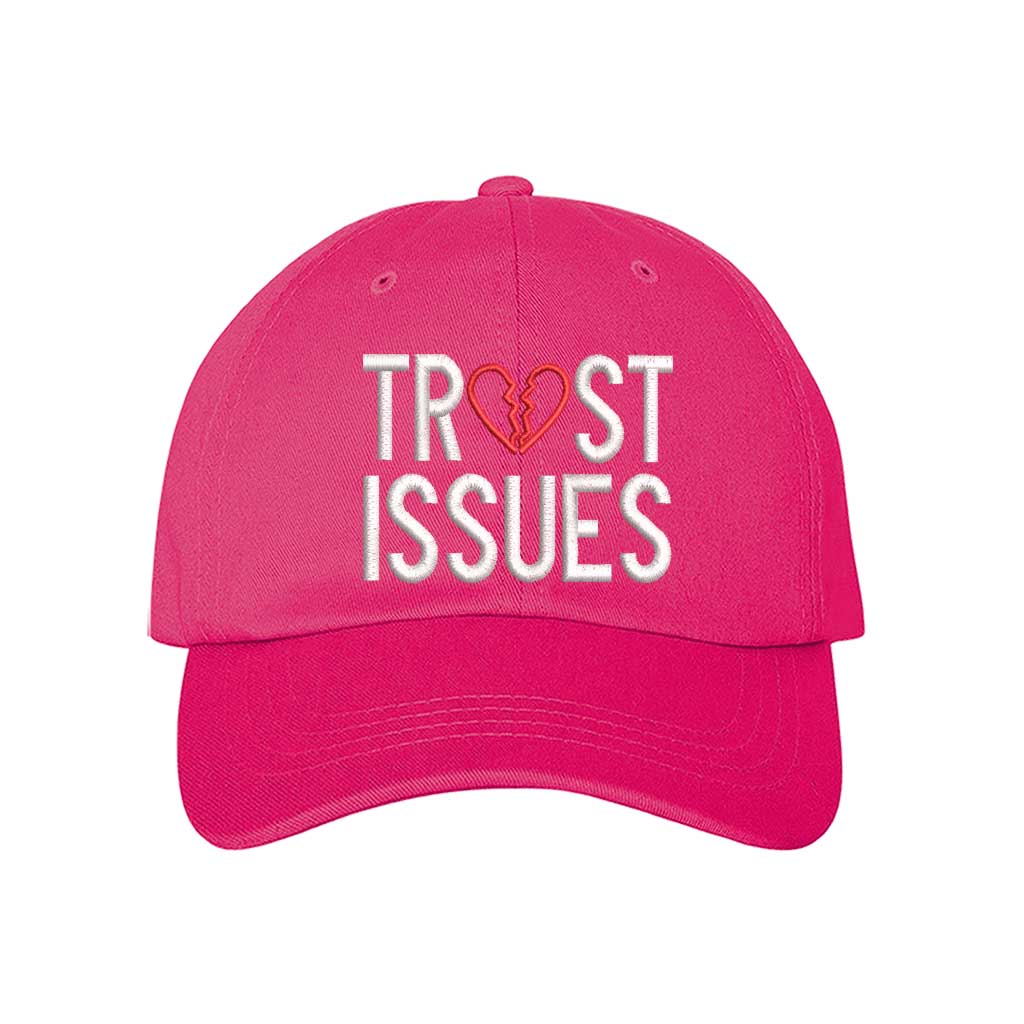 Hot Pink Trust Issues Baseball Hat featuring "Trust Issues" embroidered in a bold font on a classic dad cap; a funny and relatable statement accessory from DSY Lifestyle.