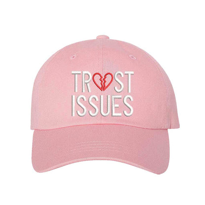 Light Pink Trust Issues Baseball Hat featuring "Trust Issues" embroidered in a bold font on a classic dad cap; a funny and relatable statement accessory from DSY Lifestyle.