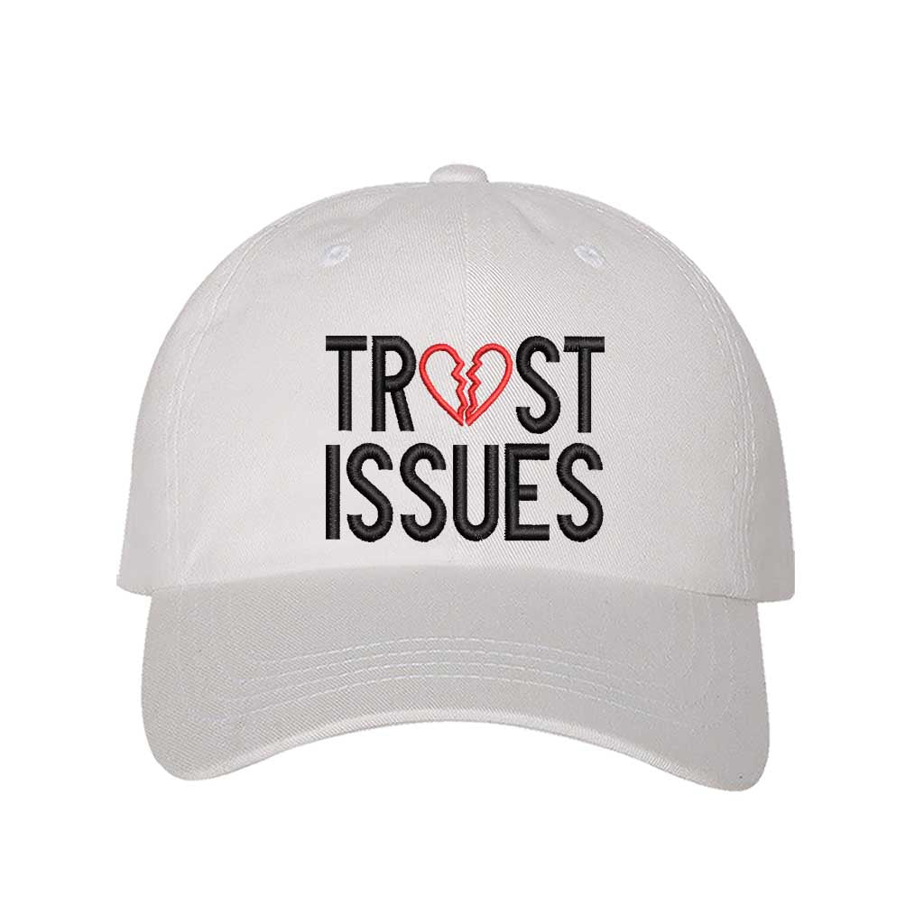 White Trust Issues Baseball Hat featuring "Trust Issues" embroidered in a bold font on a classic dad cap; a funny and relatable statement accessory from DSY Lifestyle.