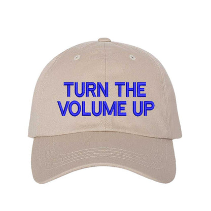 Stone with blue thread Turn Up The Volume Embroidered Baseball Hat featuring classic design, music-inspired embroidery, and adjustable hook and loop closure – DSY Lifestyle