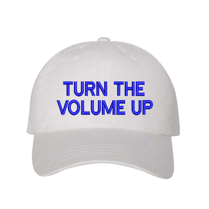 White with blue thread Turn Up The Volume Embroidered Baseball Hat featuring classic design, music-inspired embroidery, and adjustable hook and loop closure – DSY Lifestyle