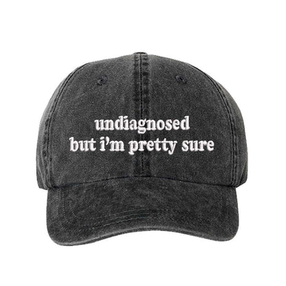Black Undiagnosed But I’m Pretty Sure washed cotton baseball hat with a soft finish and high-density white embroidery by DSY Lifestyle. - DSY Lifestyle