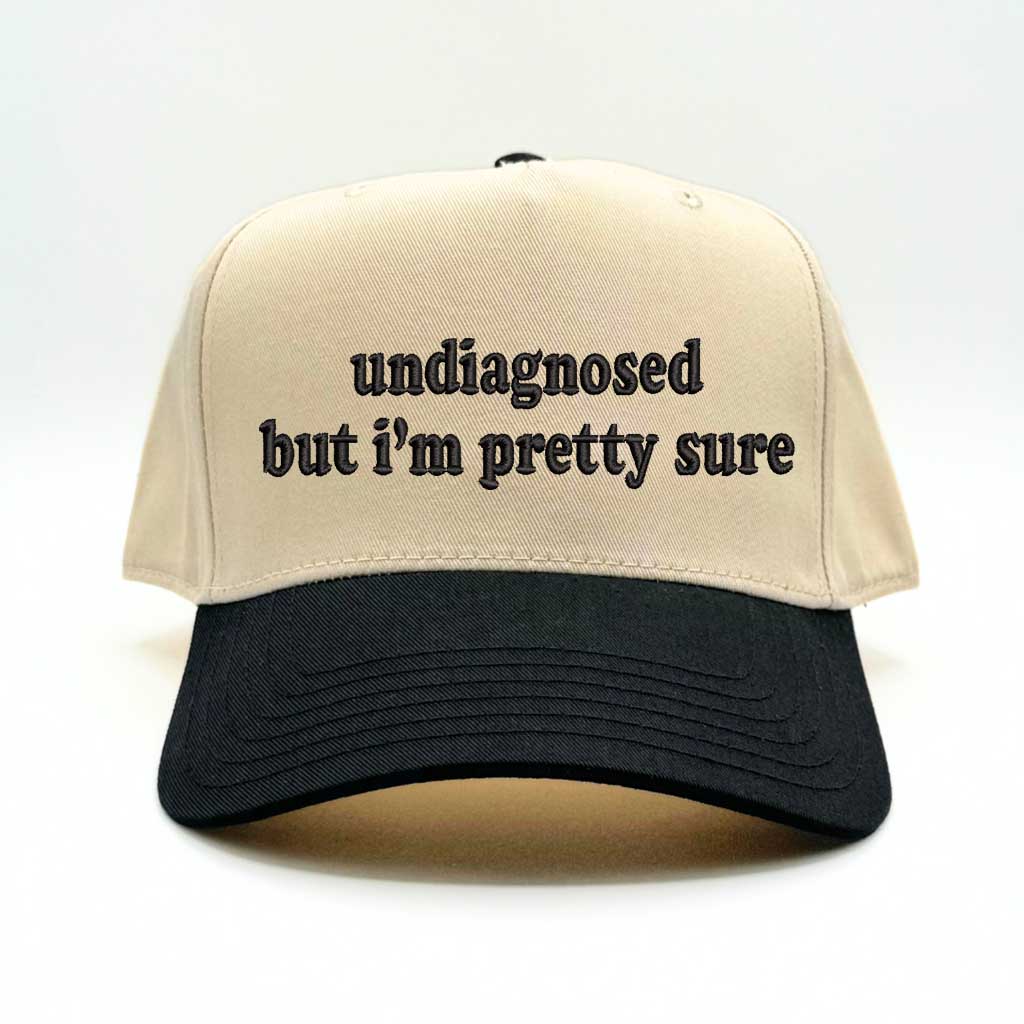 Natural baseball hat with black colored bill with the phrase  undiagnosed but im pretty sure in black embroidery-DSY Lifestyle