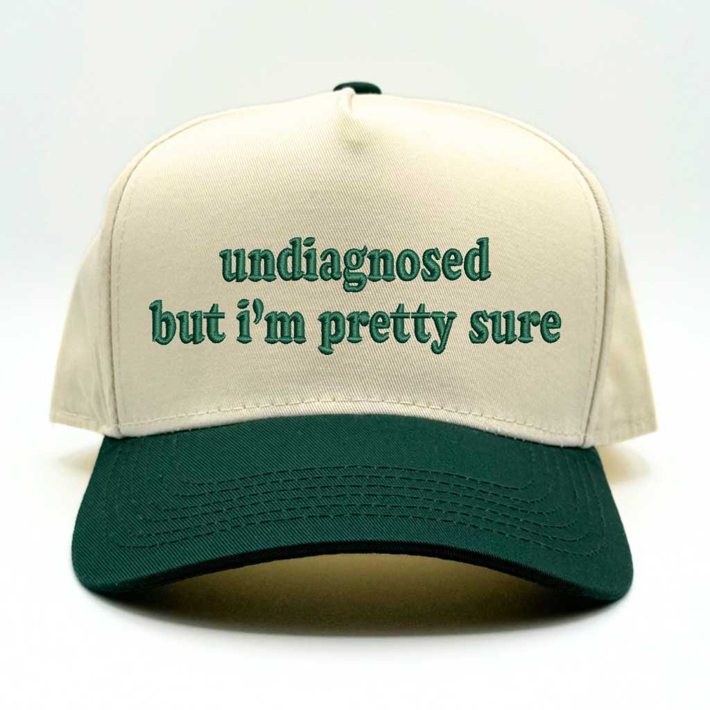 Natural baseball hat with forest green colored bill with the phrase  undiagnosed but im pretty sure in forest green embroidery-DSY Lifestyle