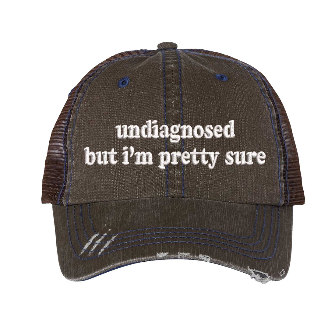 Brown DSY Lifestyle distressed trucker hat featuring the phrase Undiagnosed But I&