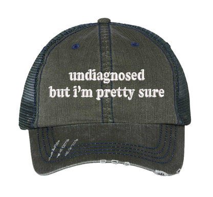 Dark Green DSY Lifestyle distressed trucker hat featuring the phrase Undiagnosed But I&