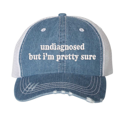Denim DSY Lifestyle distressed trucker hat featuring the phrase Undiagnosed But I&