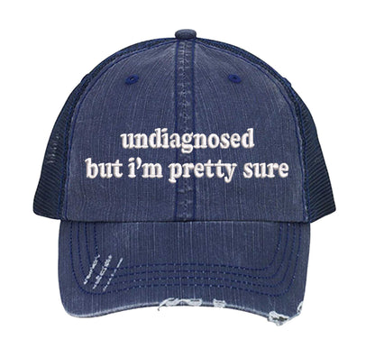 Navy Blue DSY Lifestyle distressed trucker hat featuring the phrase Undiagnosed But I&