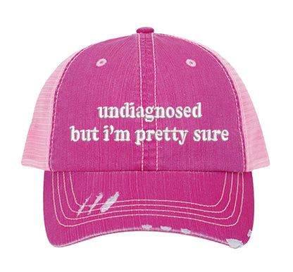 Pink DSY Lifestyle distressed trucker hat featuring the phrase Undiagnosed But I&