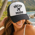 Woman wearing a embroidered Vacay Mode cap with an airplane icon at the beach- DSY Lifestyle
