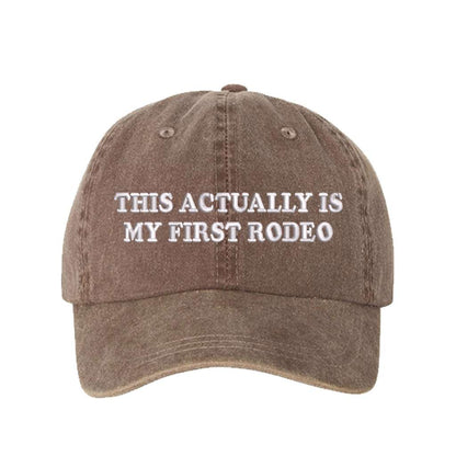 Washed brown baseball hat with the phrase this actually is my first rodeo embroidered on it-DSY Lifesetyle