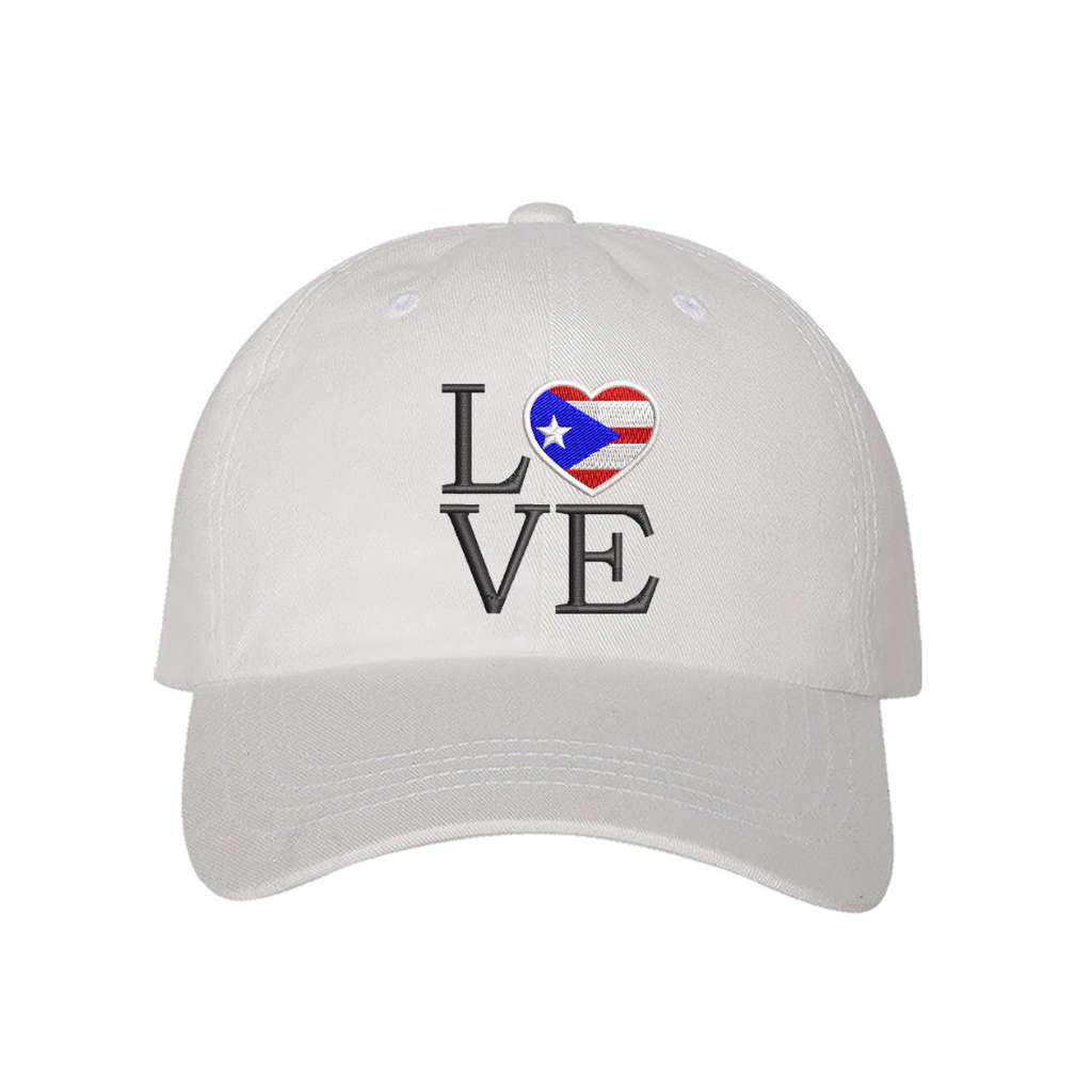 White baseball hat embroidered with Love but. the o in love is a heart with the puerto rico flag in it- DSY Lifestyle