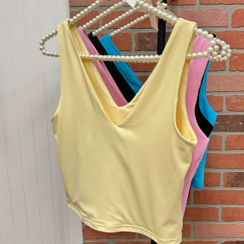 Womens vneck double layer top on rack showing all 4 colors available- DSY Lifestyle